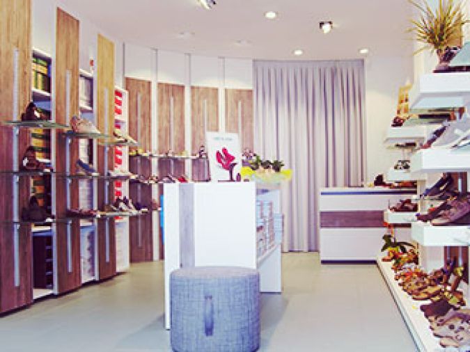 arredamento negozio calzature scarpe uomo donna bambino